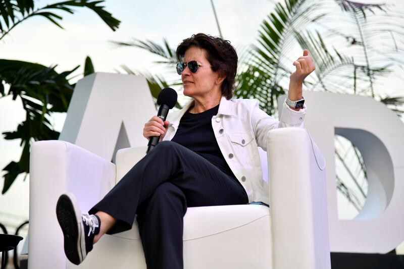 Journalist Kara Swisher sits in a chair holding a microphone at the LWTSUMMIT in September 2024.