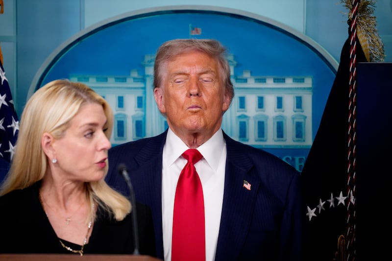 Attorney General Pam Bondi (L) accompanied by President Donald Trump, speaks during a news conference in the James S. Brady Press Briefing Room of the White House August 11, 2025 in Washington, DC.