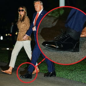 Donald Trump's cankles are visible as he returns to the White House with Melania Trump.