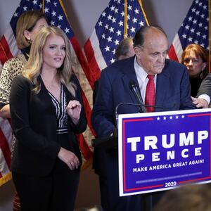 Jenna Ellis speaks as Boris Epshteyn reaches out to Rudy Giuliani during a news conference about the 2020 presidential election results at Republican National Committee headquarters in Washington, D.C., Nov. 19, 2020.