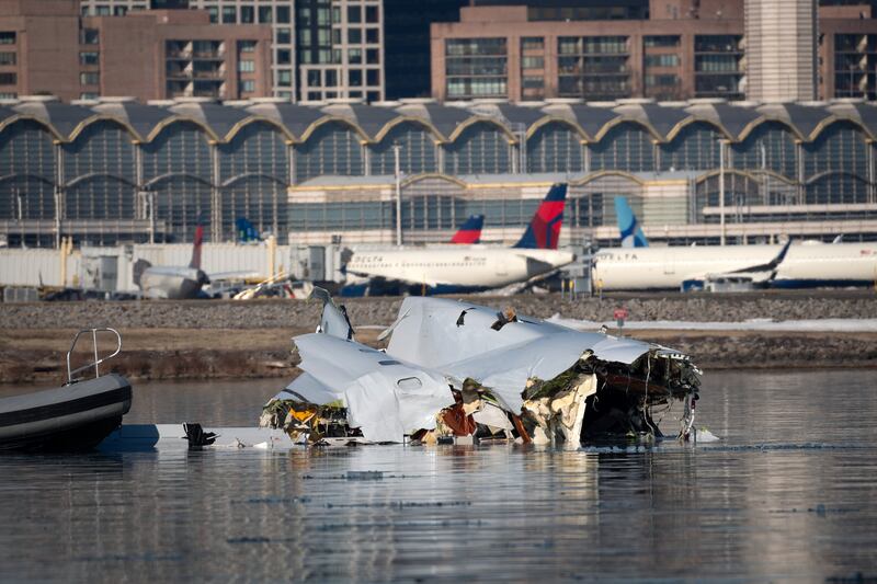 Coast Guard investigates aircraft wreckage in Potomac River.