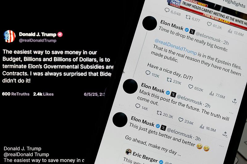 Social media posts by U.S. President Donald Trump and Elon Musk are displayed on smartphones on June 05, 2025 in San Anselmo, California. U.S. President Donald Trump has threatened to revoke government contracts from Tesla and SpaceX CEO Elon Musk as a public feud escalates over Musk's criticism of the Trump administration's policies. (Photo Illustration by Justin Sullivan/Getty Images)