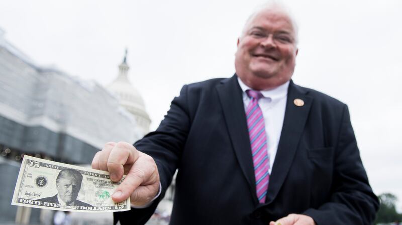 Former Rep. Billy Long flaunting his $45 Trump bills.